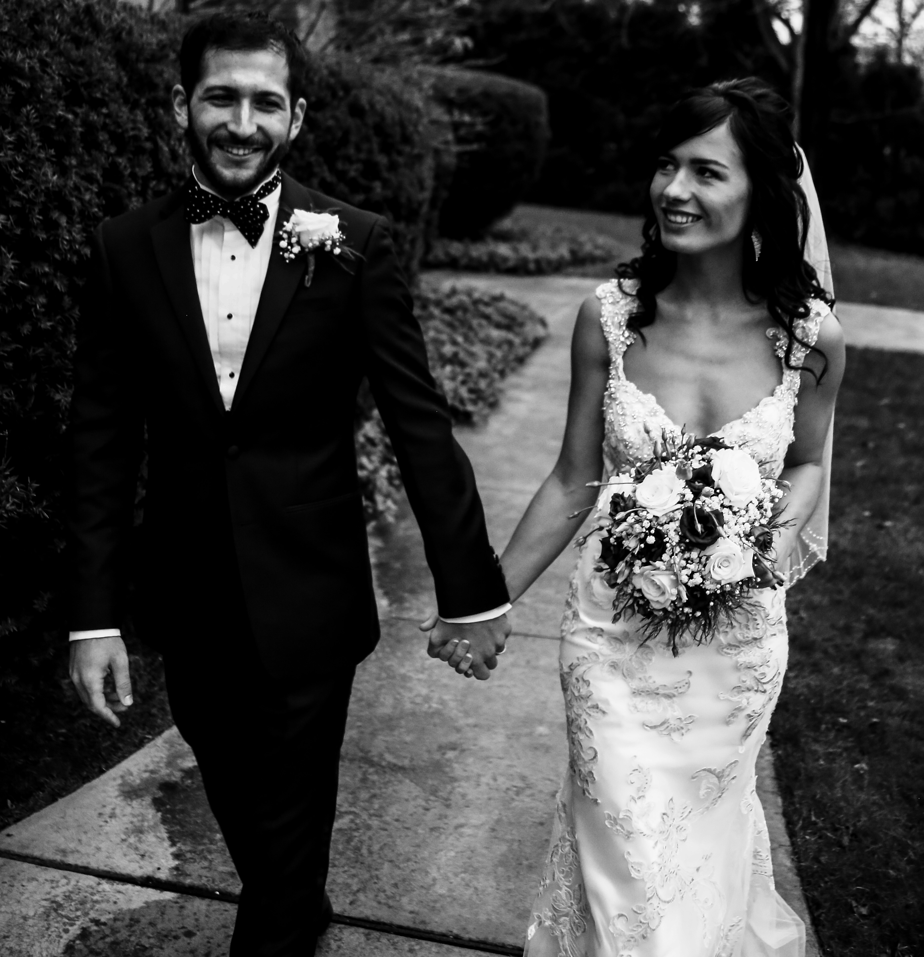 bride and groom walking together in Erie, PA