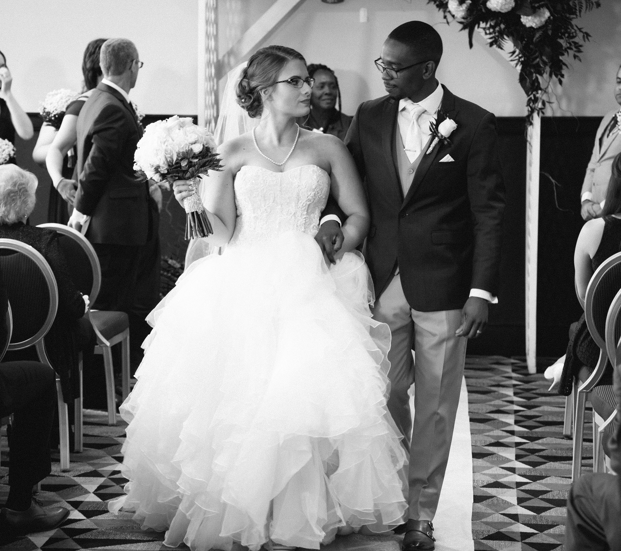 bride and groom during recessional after their wedding at Sheraton Bayfront Hotel Erie, PA