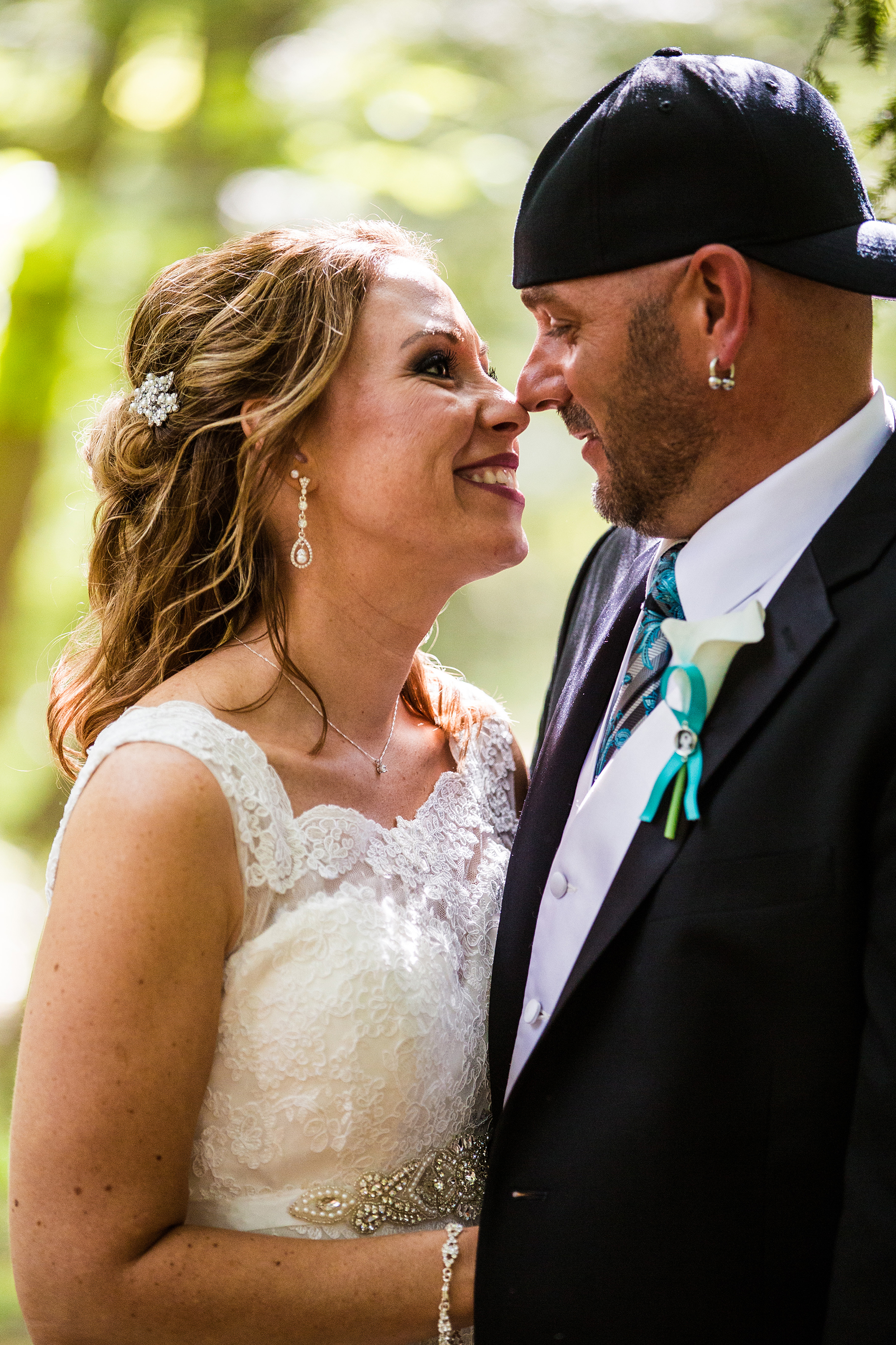 bride and groom smiling at each other in Erie PA backyard wedding