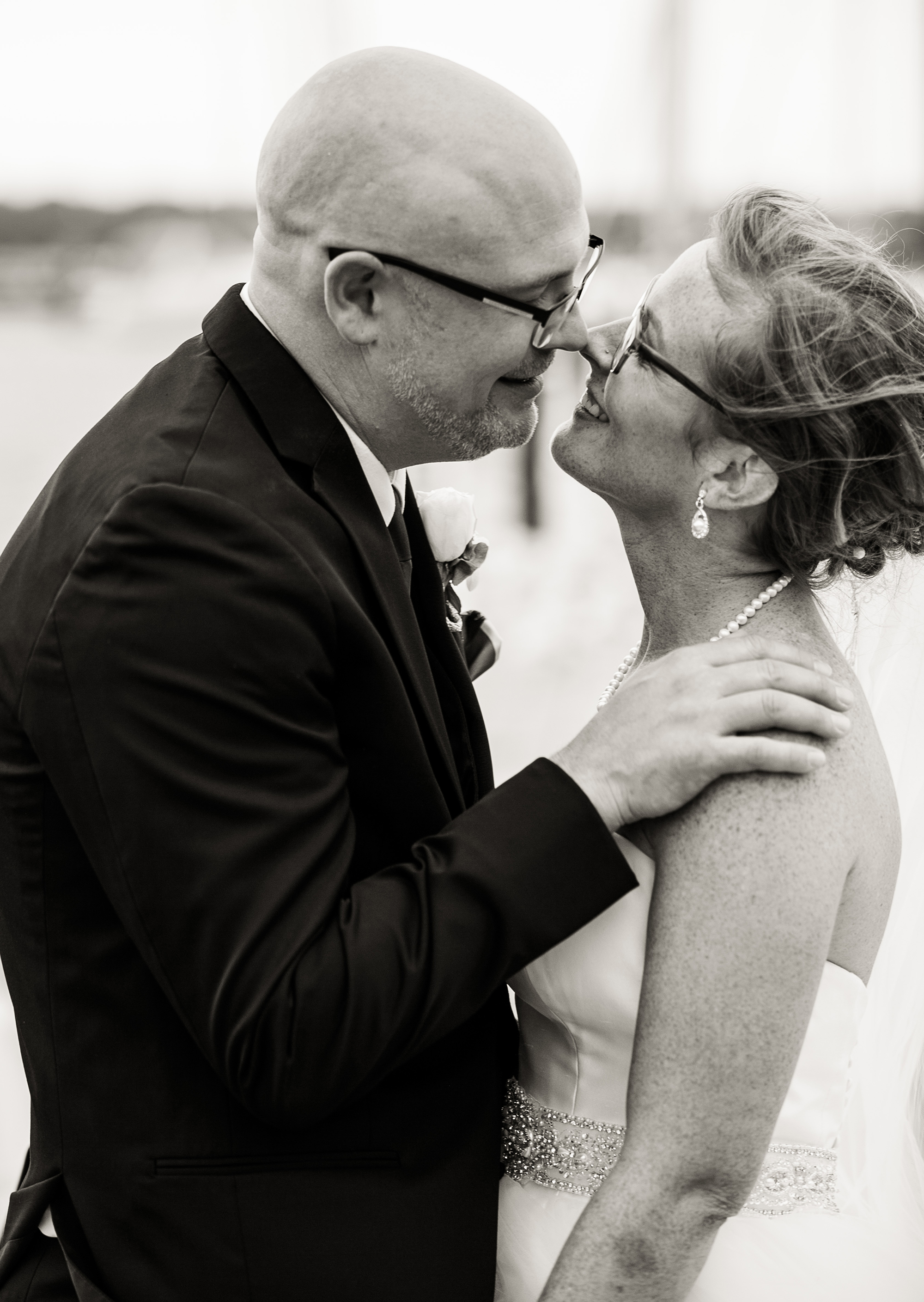 Bride and groom smile at each other during Erie PA Masonic Temple wedding