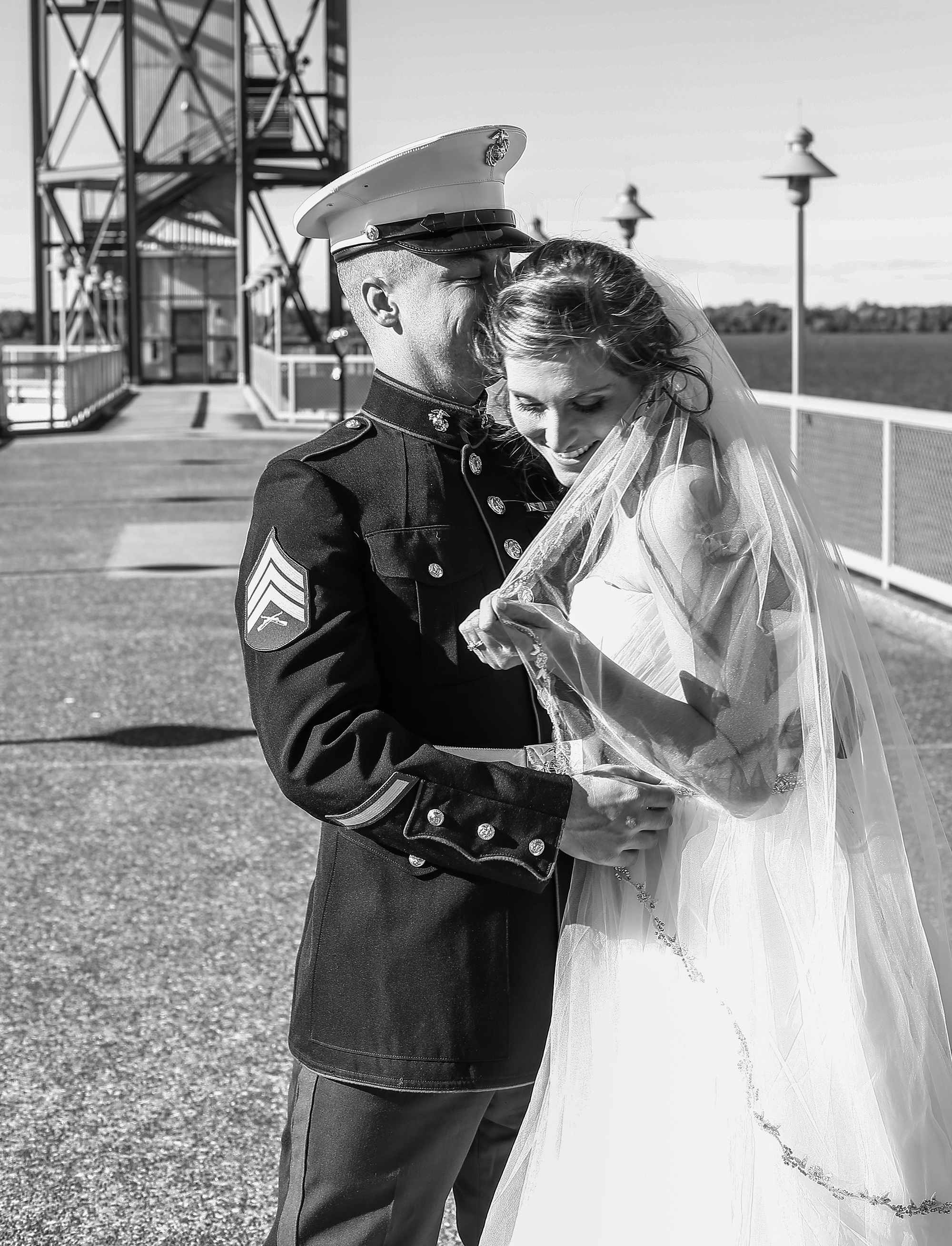 Bride and groom laughing in front of Bicentennial Tower in Erie PA