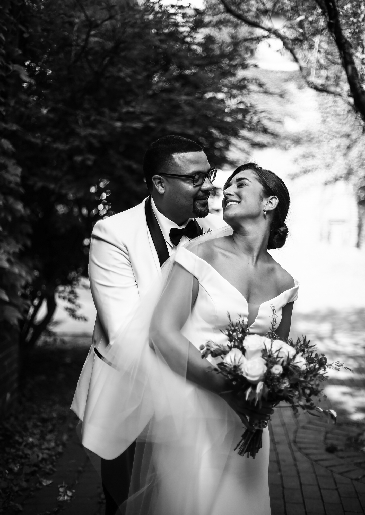 Bride and groom smile at each other at Modern Tool Square