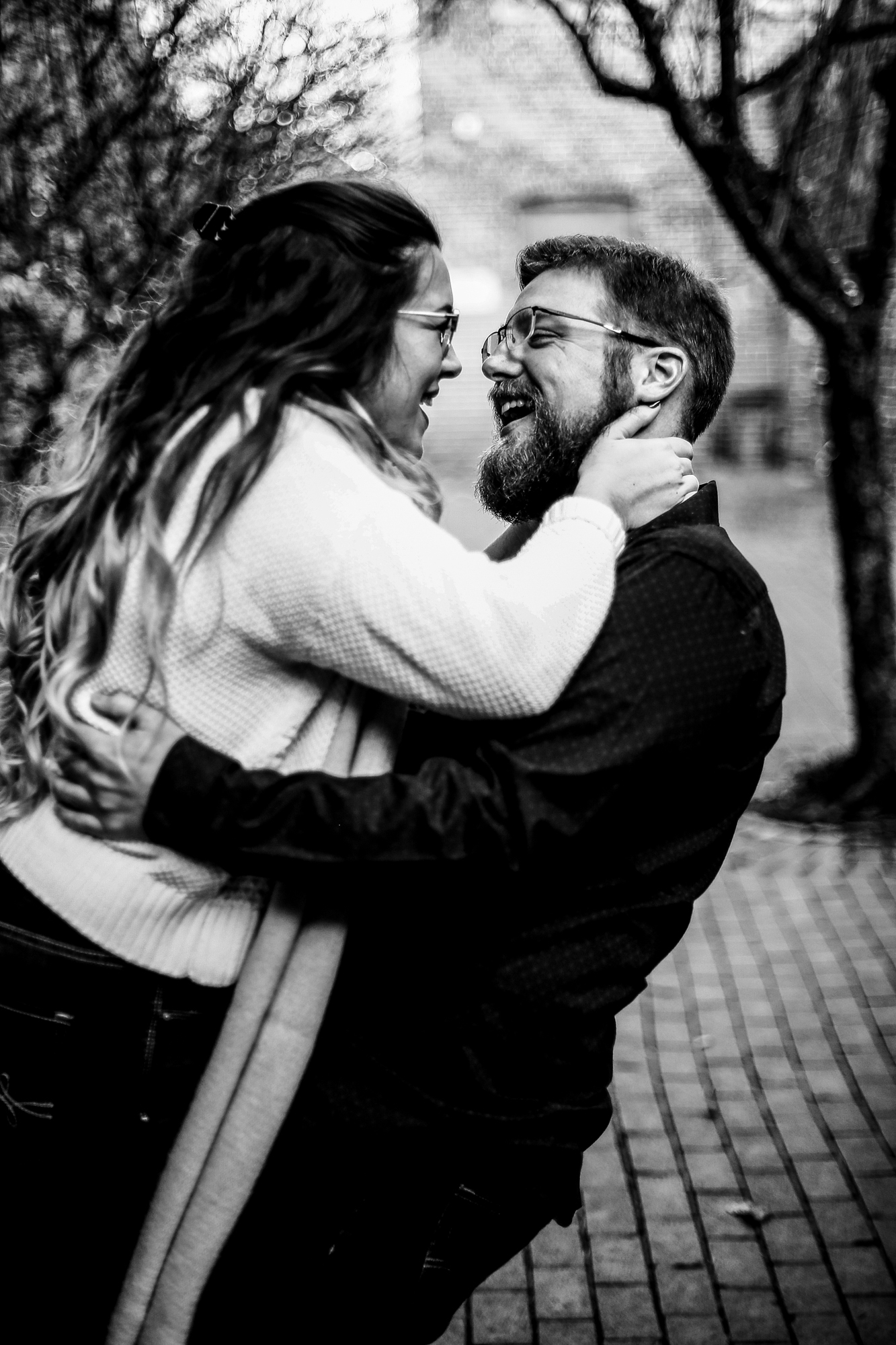 Couple embraces and laughs for engagement photos around Erie PA PA