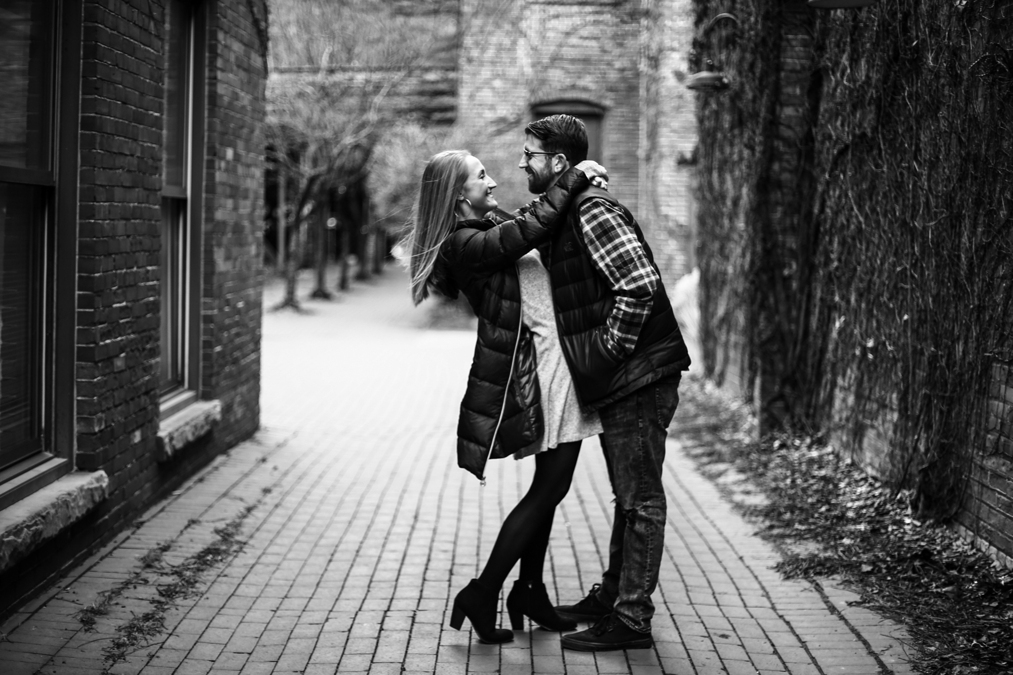 Engaged couple embracing for engagement session at Modern Tool Square