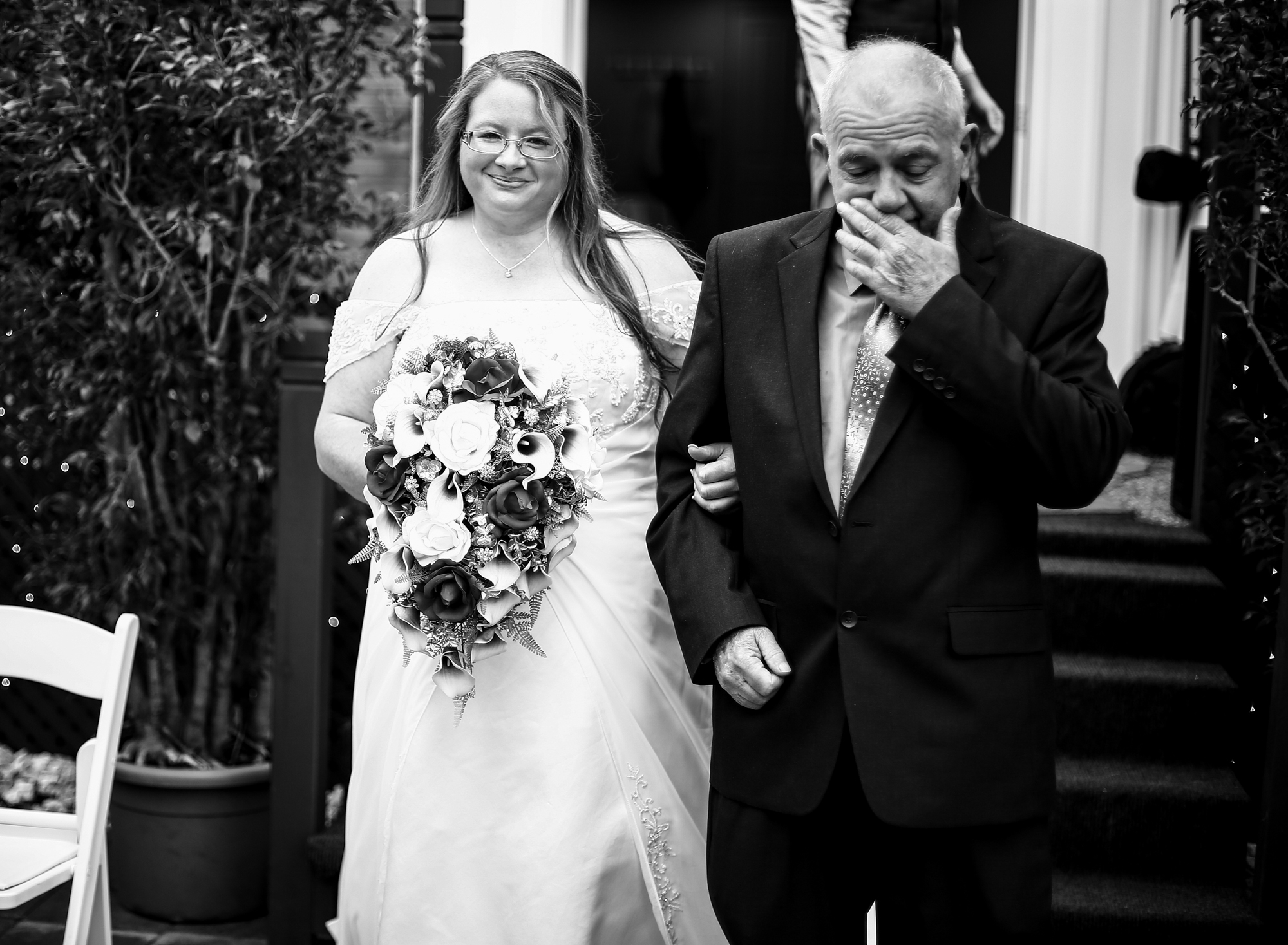 Bride escorted by her father at intimate home wedding in Erie, PA