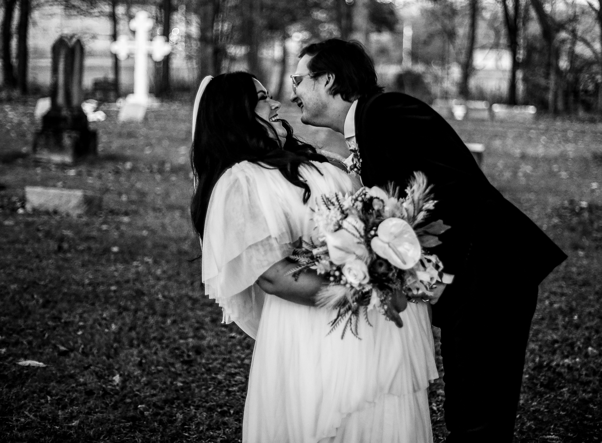 Bride and groom laughing in local cemetery in Clymer, NY