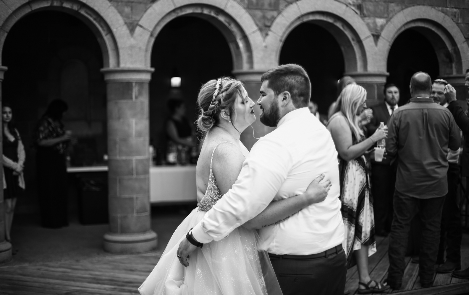 Couple shares first dance in the courtyard at Beach Glass Estates wedding