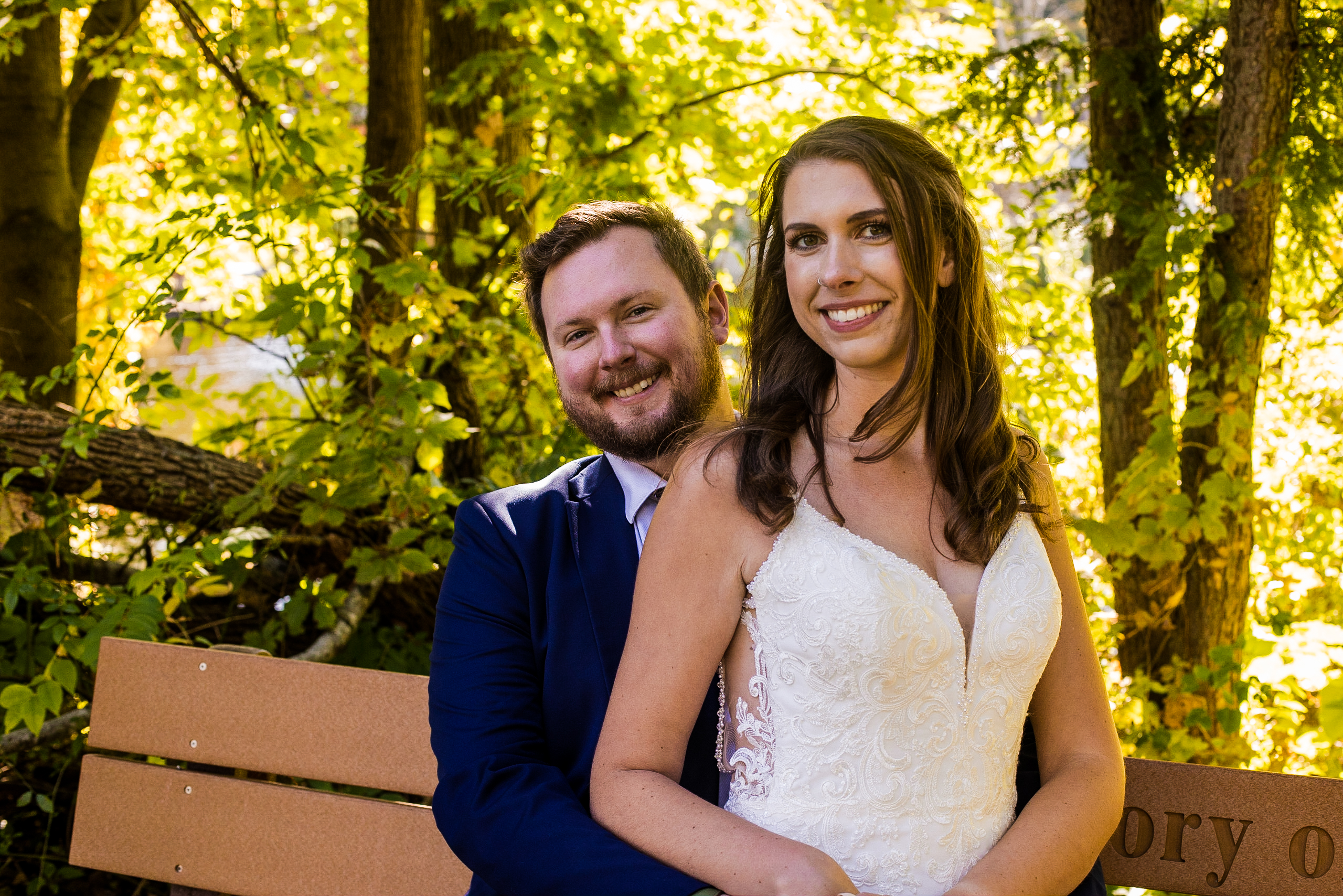 Man and woman smiling at camera for anniversary photo session