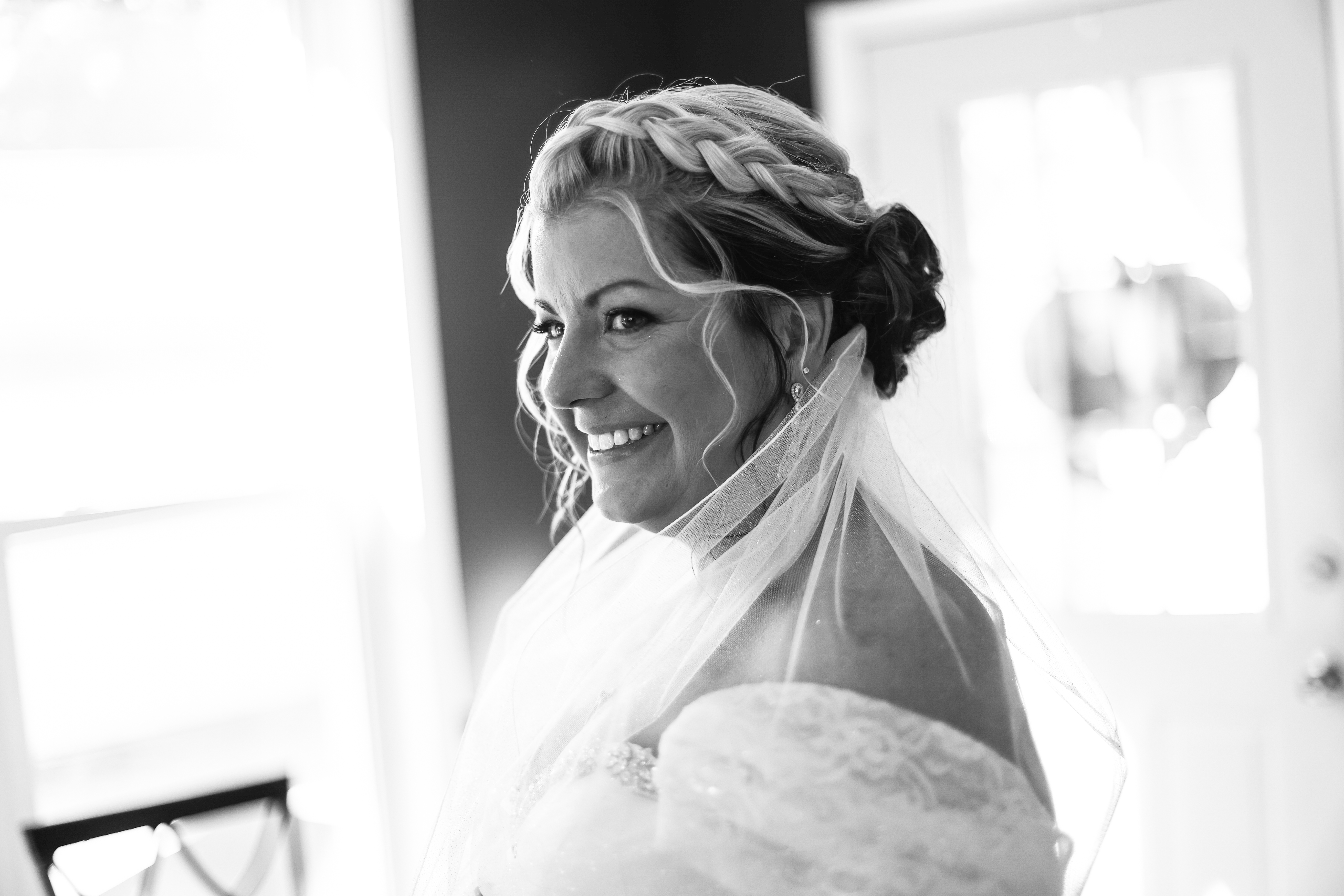 Smiling confident bride in her wedding outfit