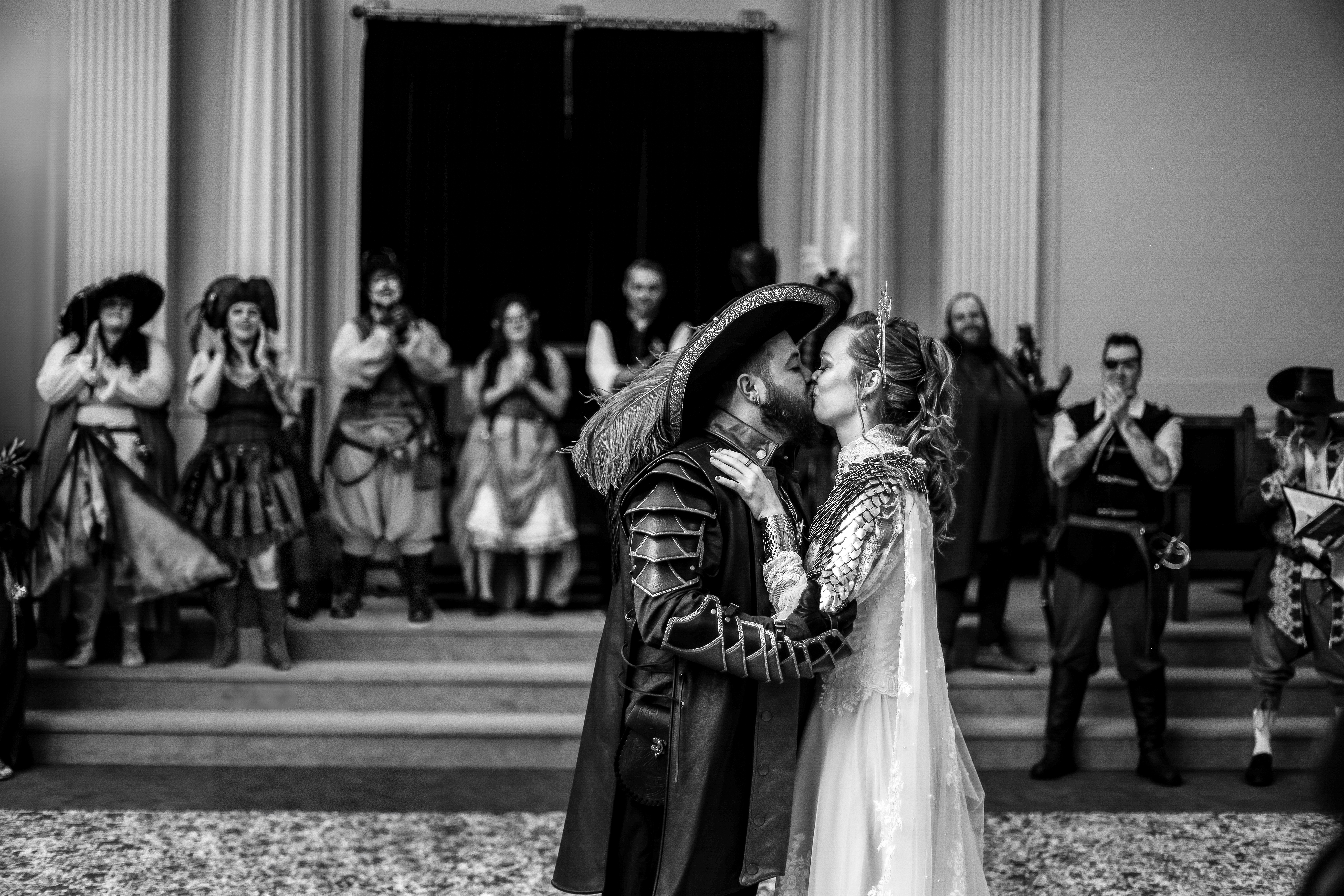 Bride and groom kiss during Dungeons & Dragons themed wedding